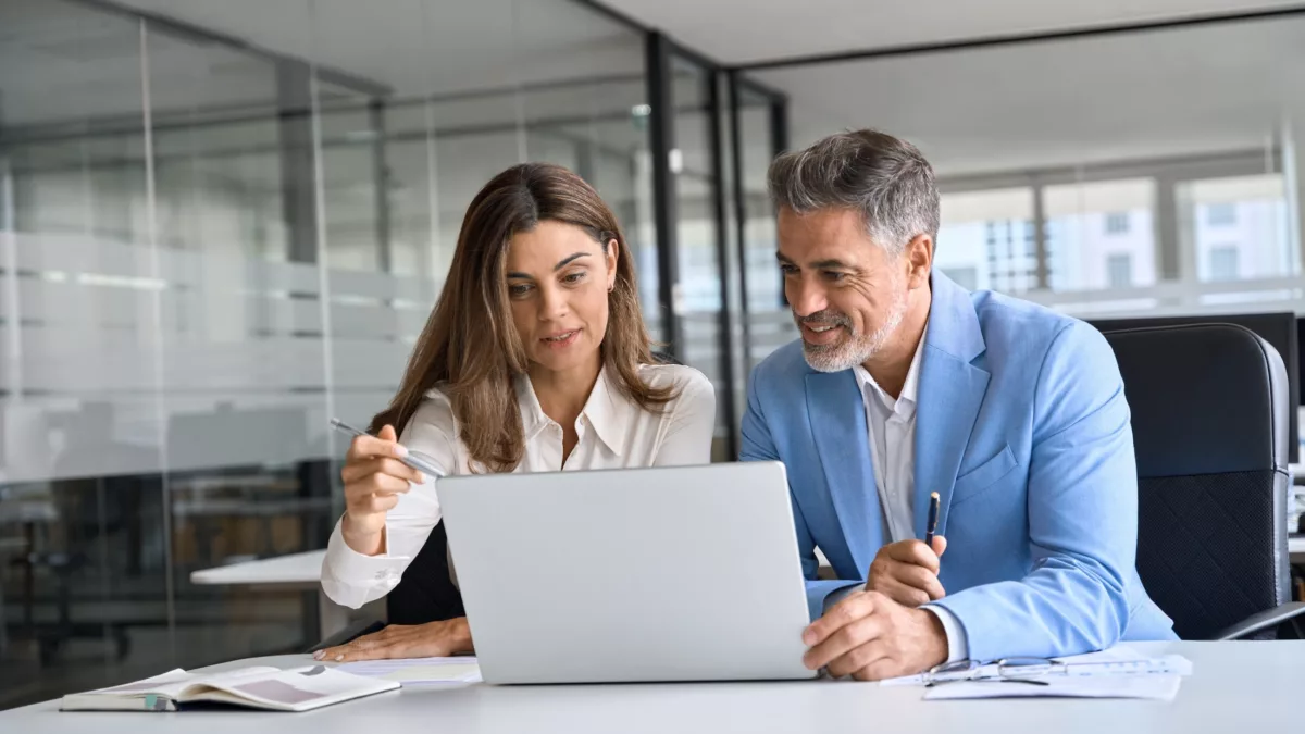 franchisee receiving digital training through a modern LMS platform on a tablet or laptop